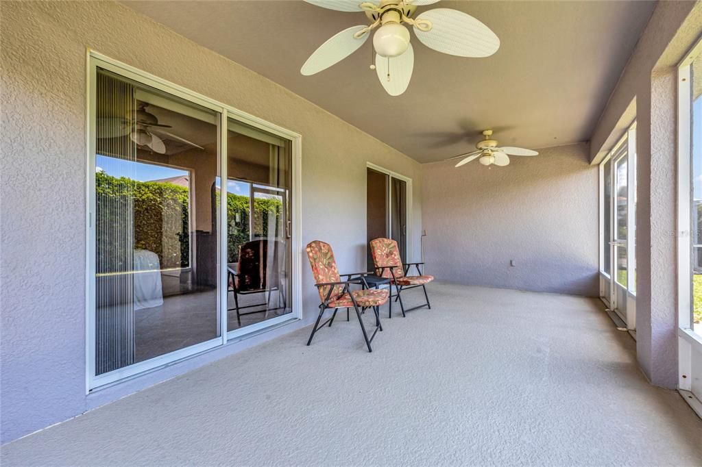 Lanai features 2 Ceiling Fans and access from primary bedroom & living room