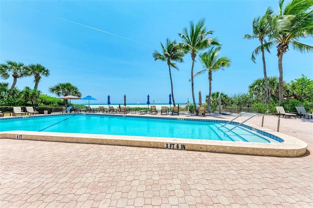 Gaze at the beach and Gulf of Mexico while wading in the pool.