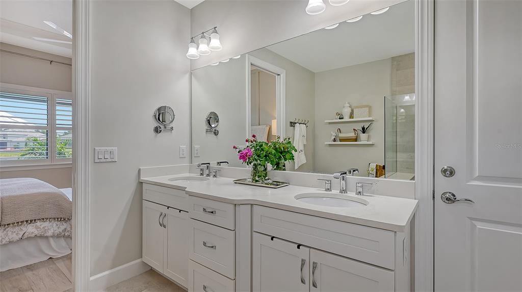 Walk-in shower with a transom window for extra lighting and plenty of room for a bench