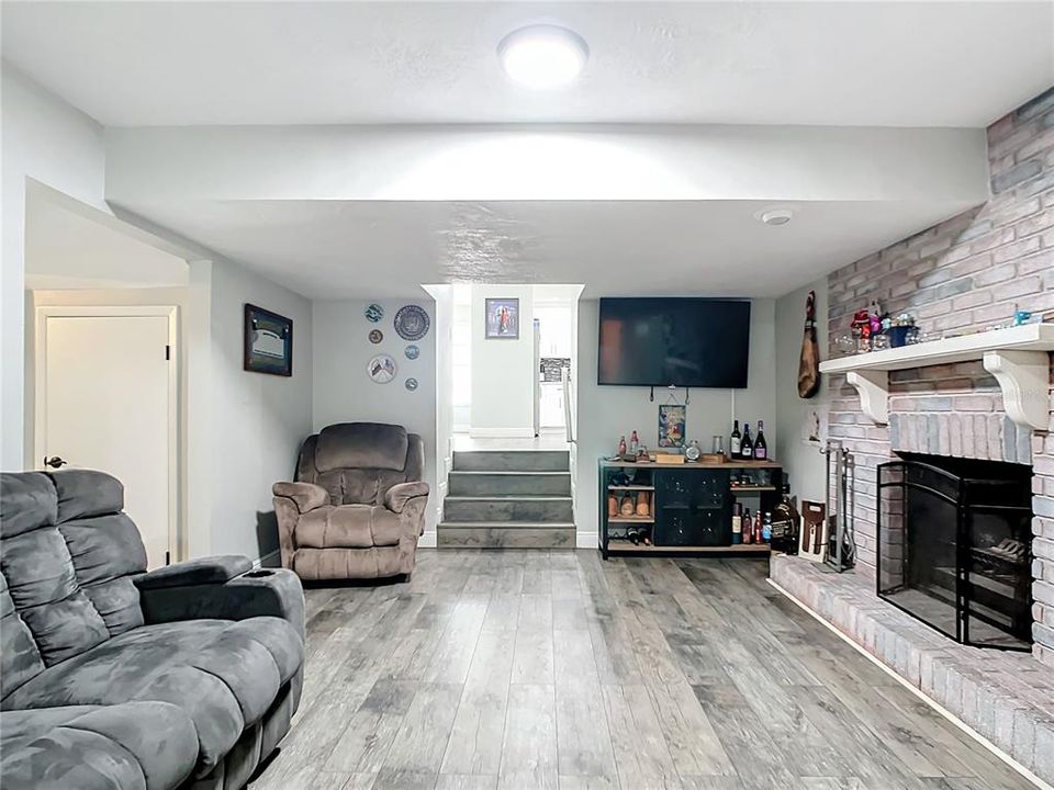 Family Room with fireplace - stairs to community space
