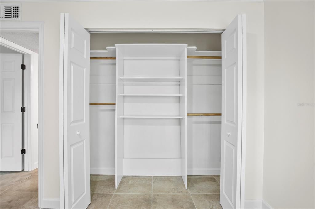 Closet organizers in the 2nd bedroom enhance the storage capacity