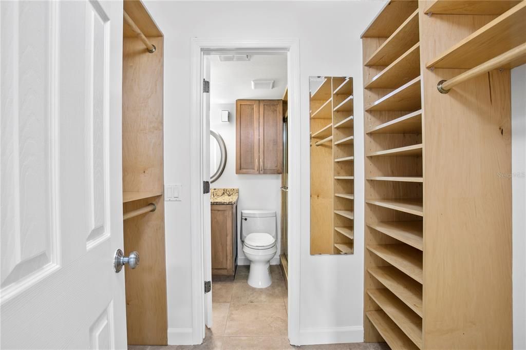 Beautiful closet organizers in primary bedroom enhance storage capacity.