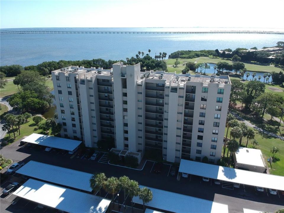Front of Bldg. 2620. Covered assigned parking. Fron unit a view of the golf course, Tampa Bay, The Bayside Bridge and all the way to downtown Tampa.