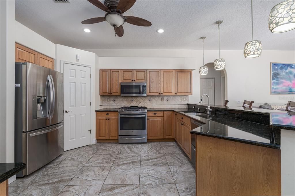 3014 River Woods Dr. Parrish, FL 34219  MLS #A4610018Kitchen with stainless appliances, breakfast bar and eat in dining area