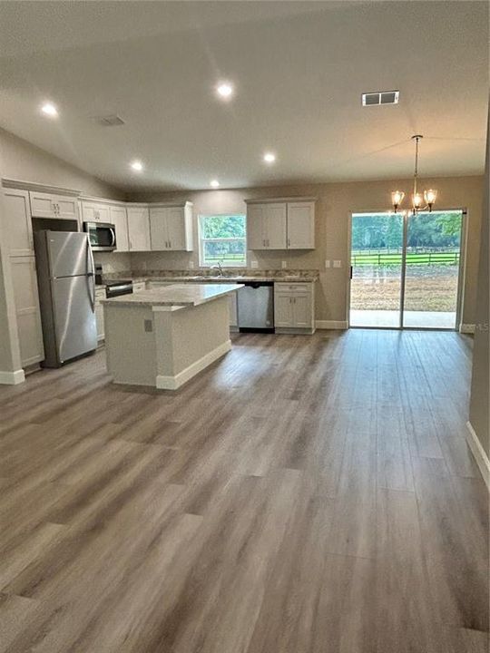 kitchen, dining area and living room