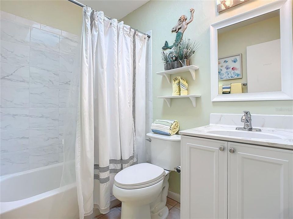 Second Bathroom- Tile shower with tub