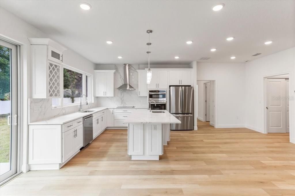 Beautiful Matching Quartz Backsplash creates High End Finished Look