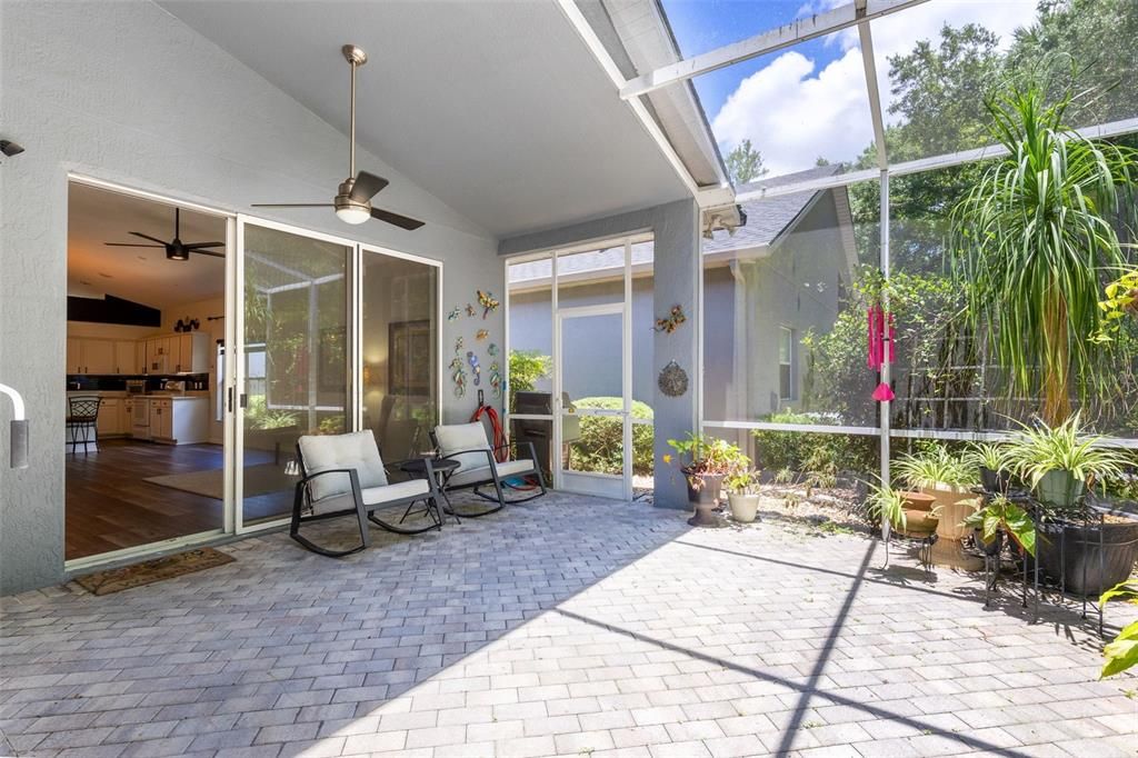 Triple sliders adorn the back of the home leading from the family room to the patio.