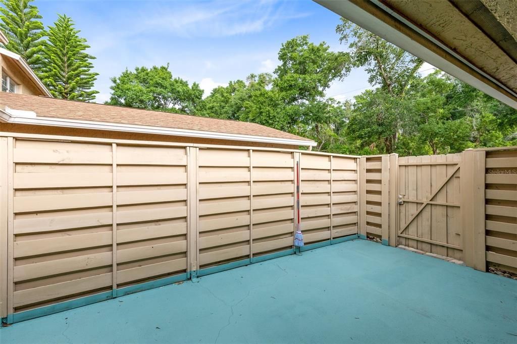 Through the one car garage, you’ll step outside to the private courtyard/patio, a fenced-in oasis perfect for unwinding after a long day.