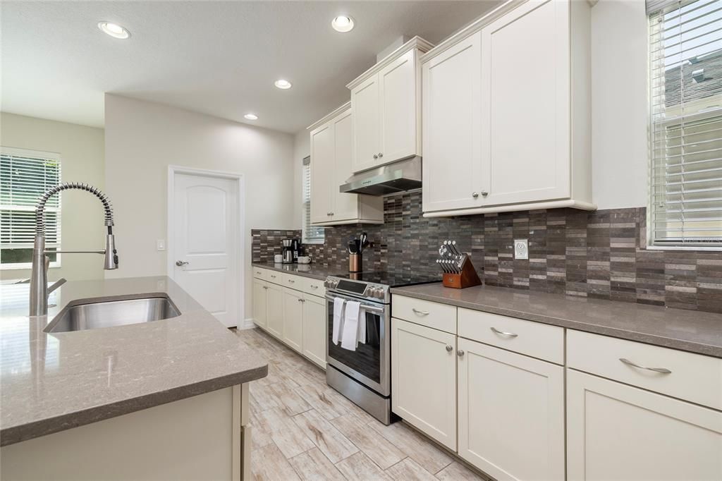 Extra counter space, wood cabinets, and stainless steel appliances