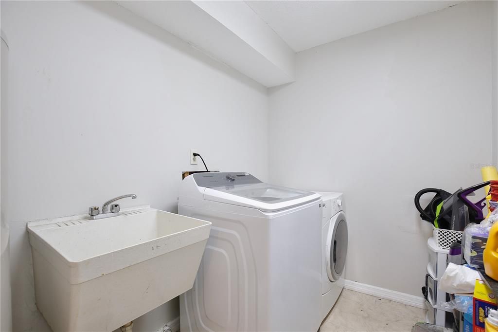 Large inside laundry room with sink