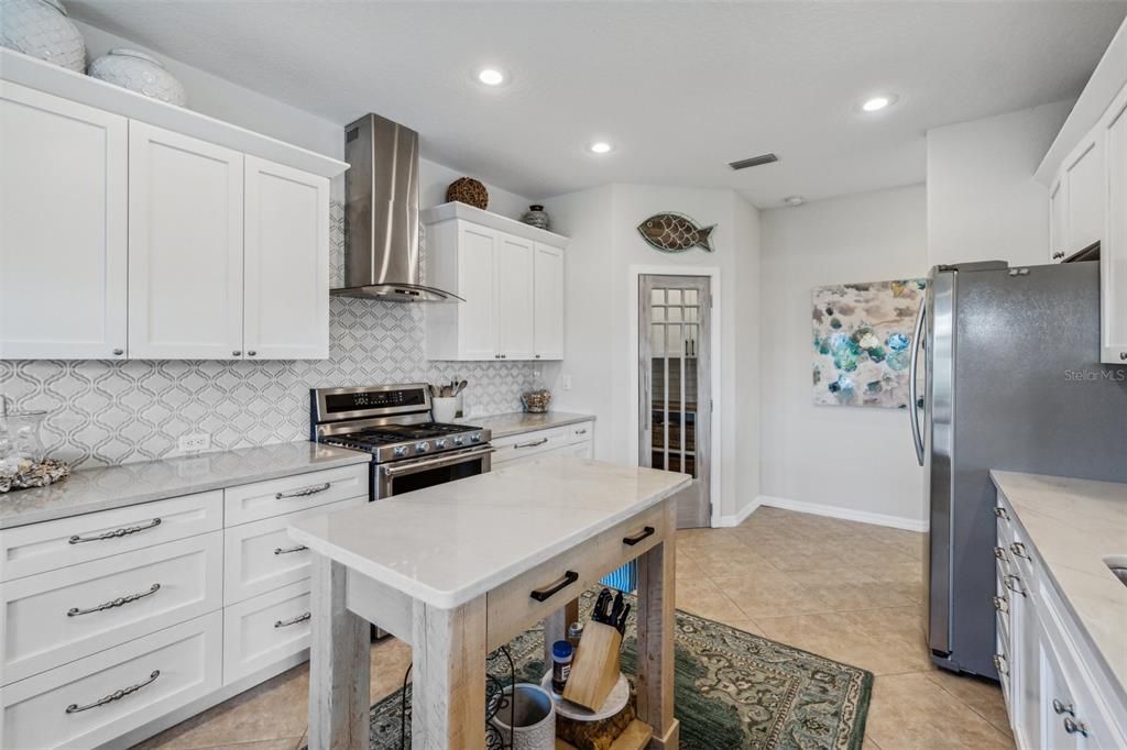 Solid wood cabinets and Calacutta quartzite countertops