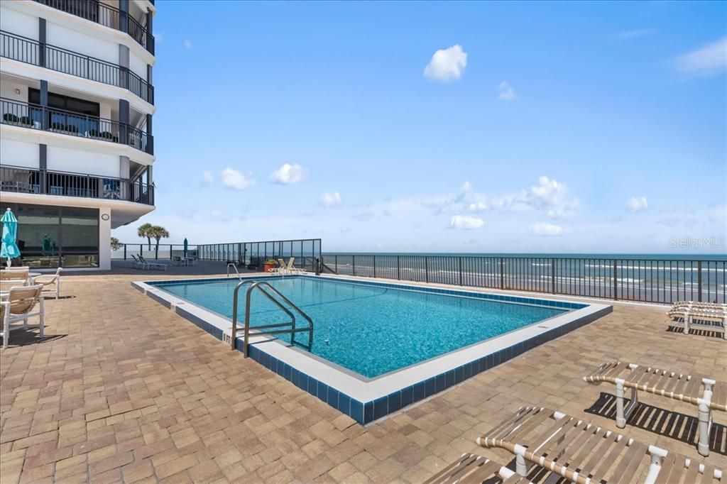 Refreshing view of heated pool looking northeast to the beach