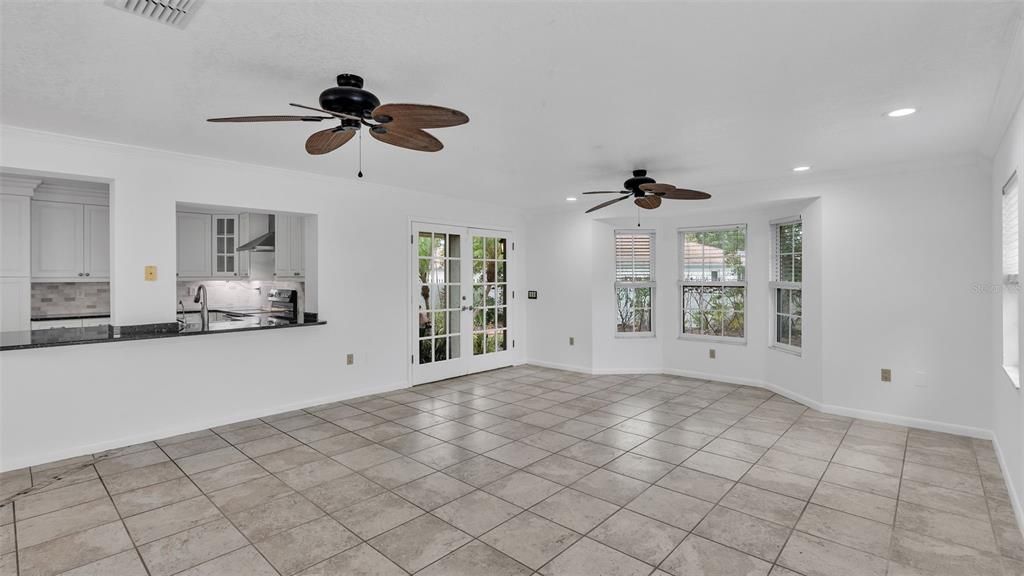 Windows and french doors brighten the space