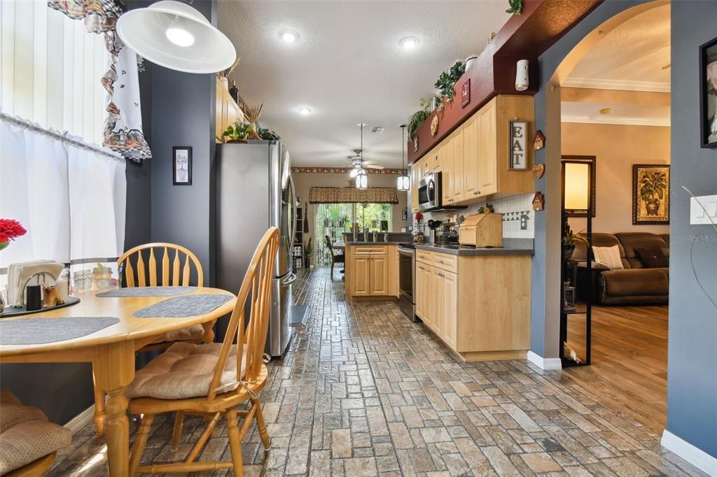 Eating space in kitchen facing towards rear of home.