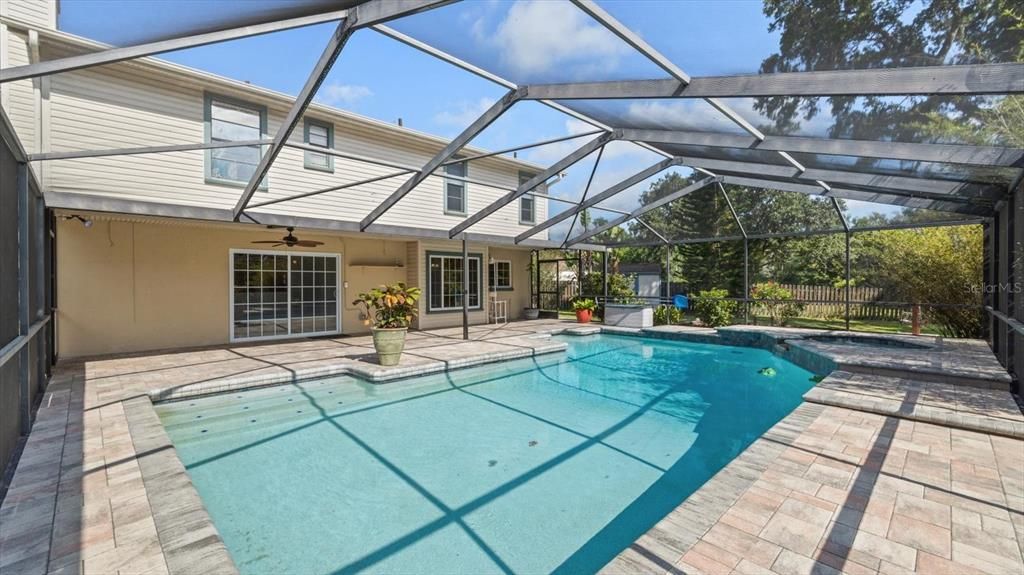 Screened in pool with paved patio