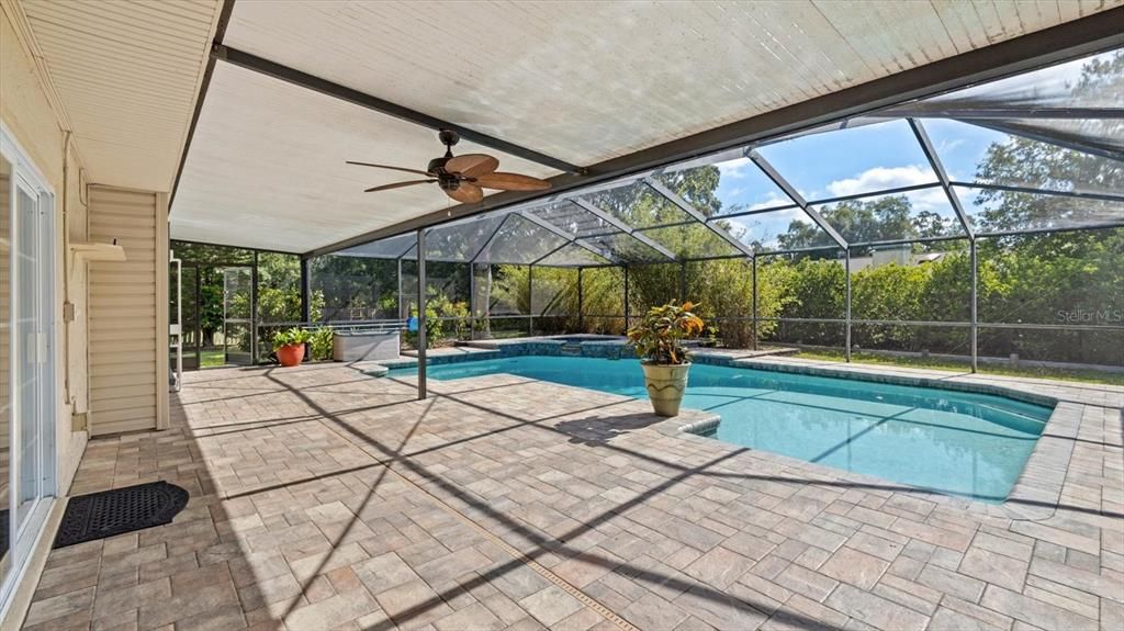 Screened in pool with paved patio