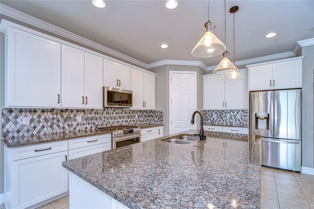 42” cabinets complimented by granite countertops and a beautiful custom backsplash!