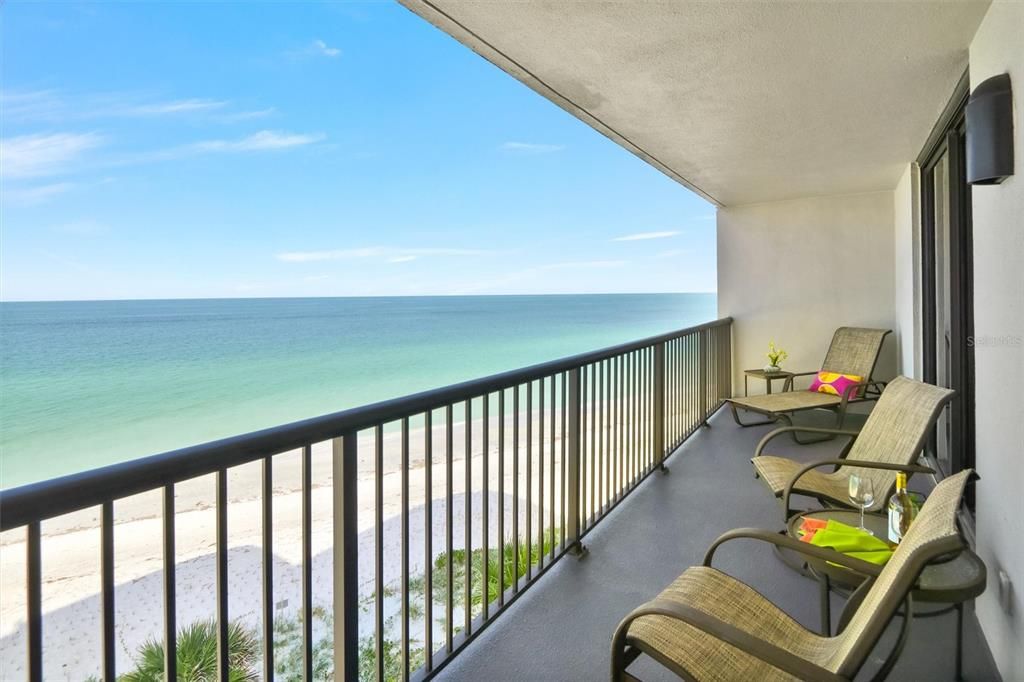 Beach Side of wrap around balcony with sliders to Owner's suite