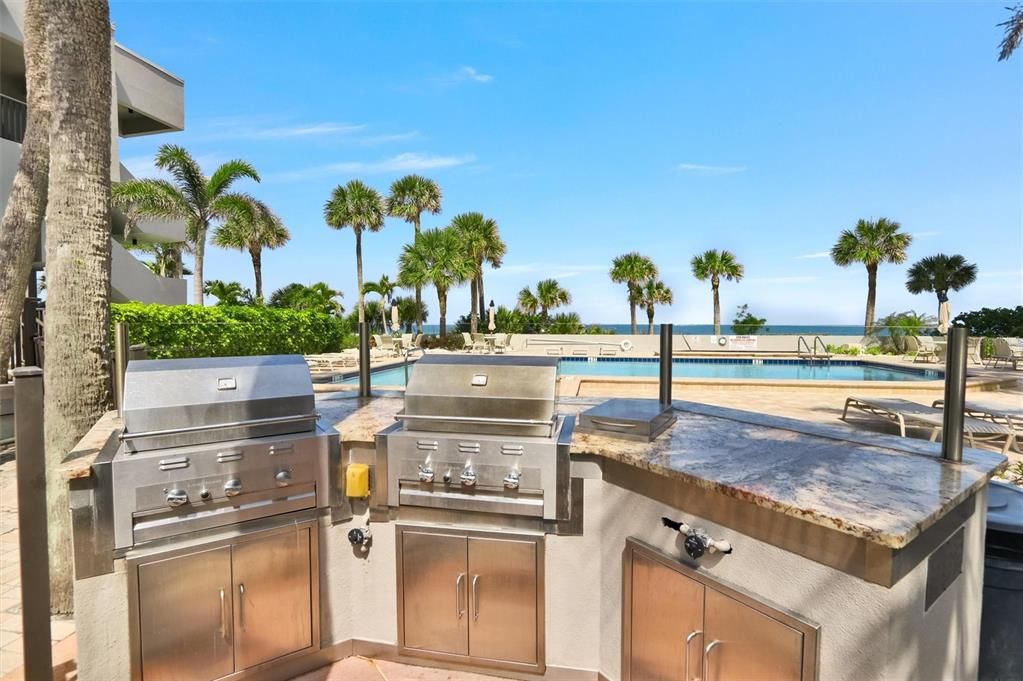 Outdoor cooking area by pool, overlooking Gulf of Mexico
