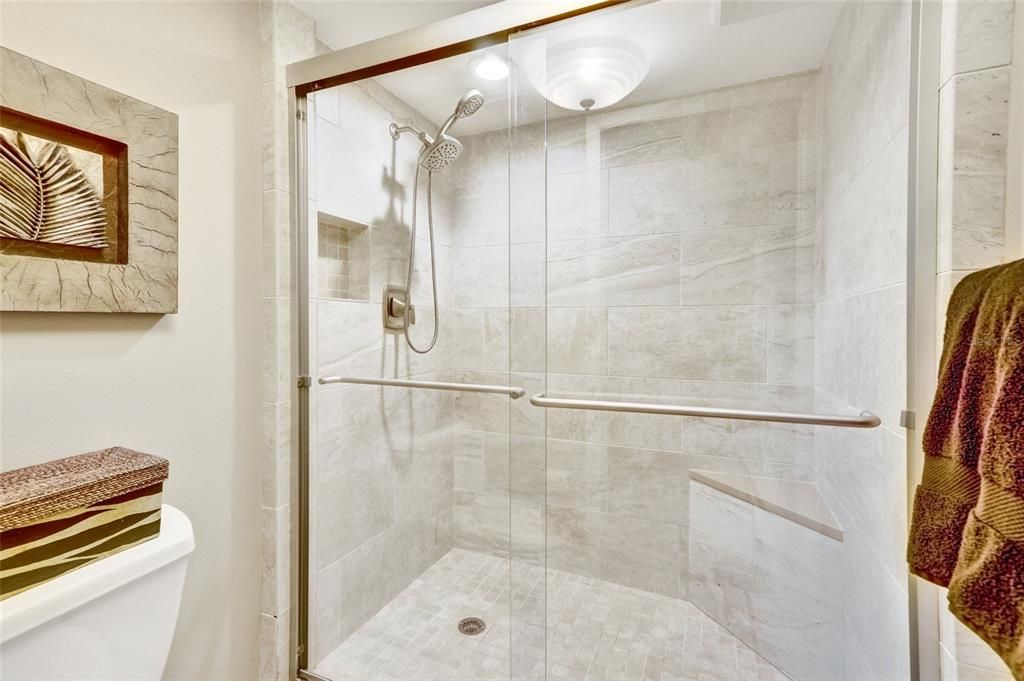 Guest Bathroom with walk-in shower and private toilet