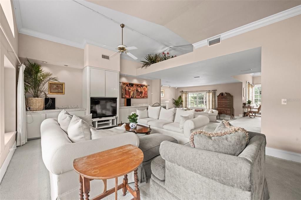 Living room opens to the family room and has Cathedral ceilings