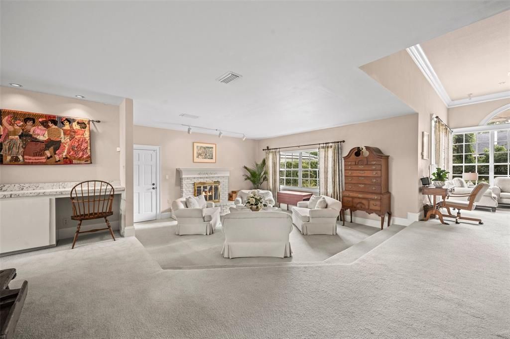 Living room opens to the family room and kitchen