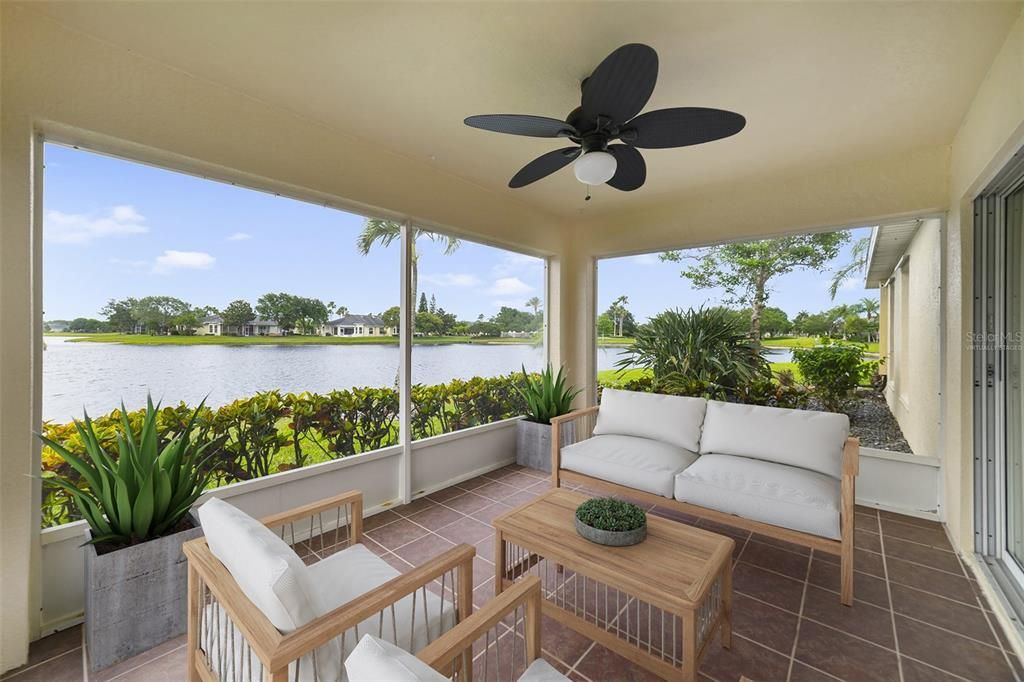TRIPLE SLIDING GLASS DOORS bring the water views right to you and open up to a SCREENED LANAI where you can start the day with your favorite cup of coffee or catch a glimpse of the latest rocket launch. Virtually Staged.