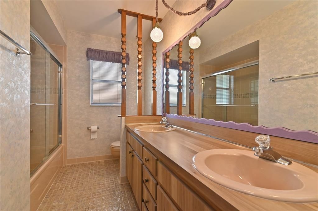 The guest bathroom with double vanity gives plenty of space.
