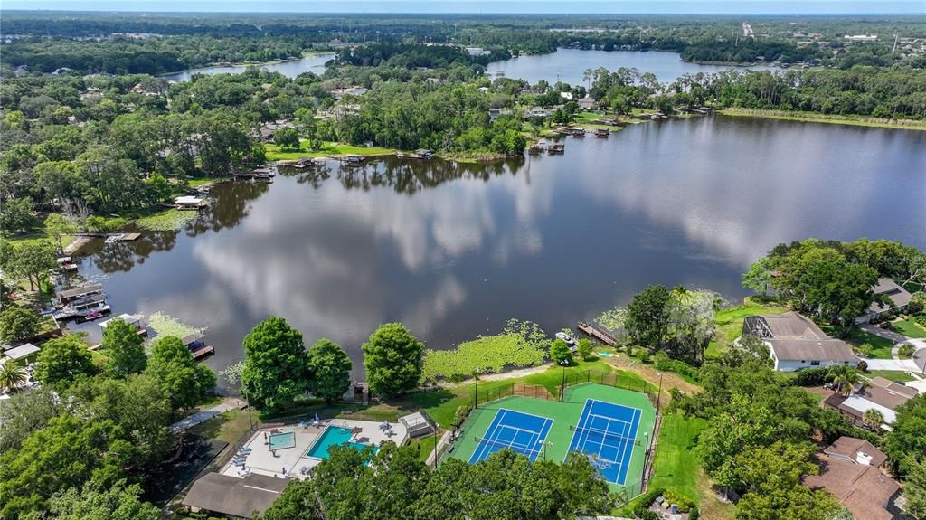 A view of Lake Pearl, the community pool, and the tennis courts.