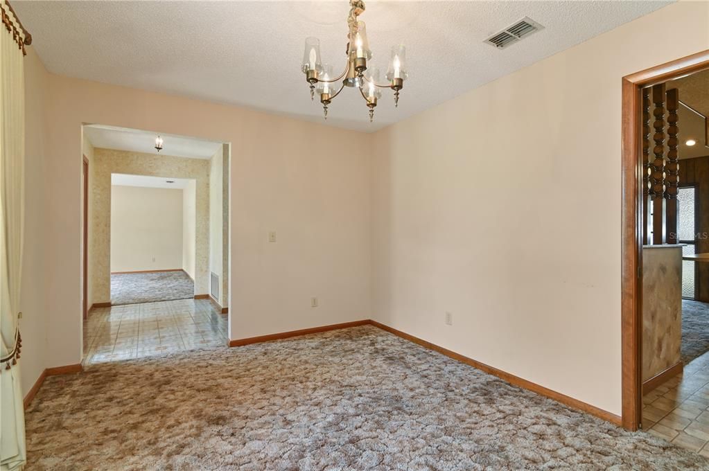 The dining room provides access either from the front hallway or the kitchen.