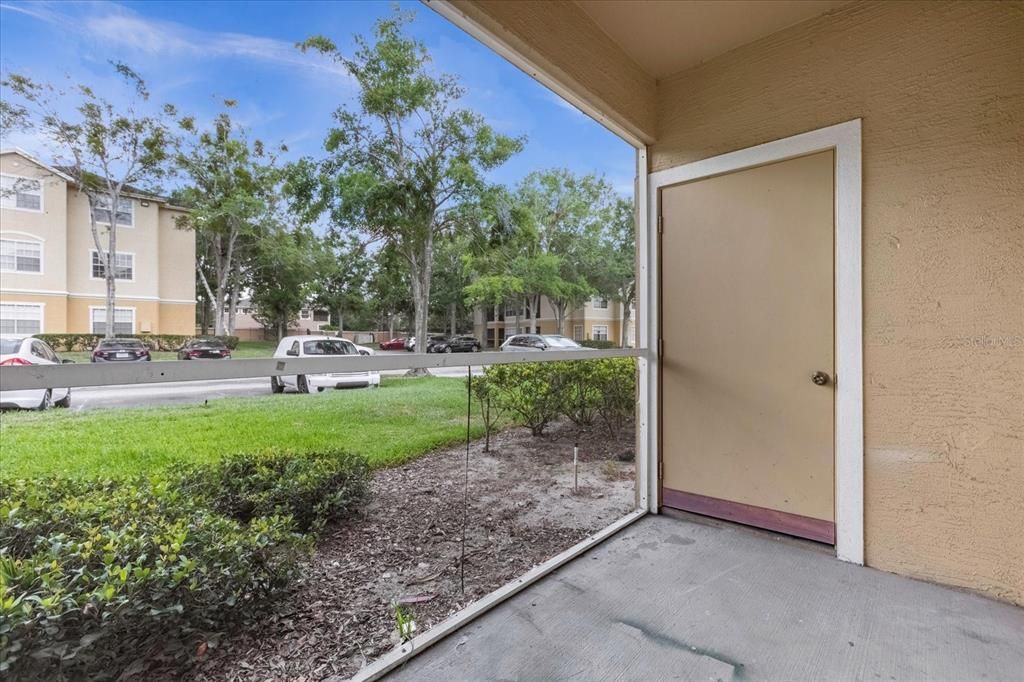 Screened-in patio with storage room