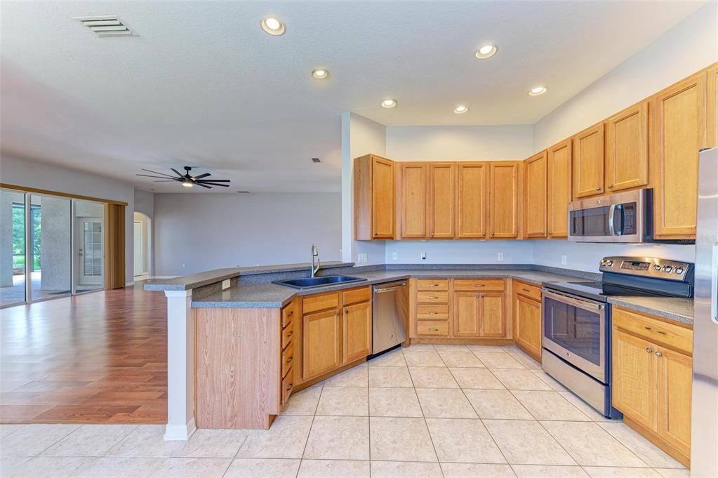 The kitchen overlooks the lake and Family Room.