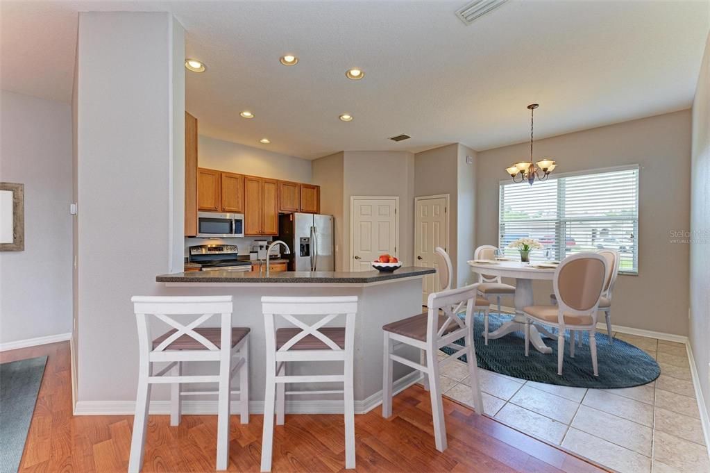 Virtually staged kitchen with eat-n Breakfast Nook.
