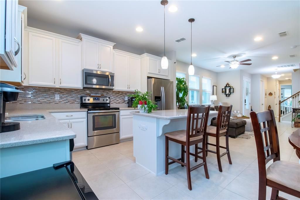 Updated backsplash, under cabinet lighting, top-of-the-line stainless steel appliances, solid wood cabinets with 42” uppers, added pullout drawers, spacious pantry, a hot water recirculation system, for efficiency.