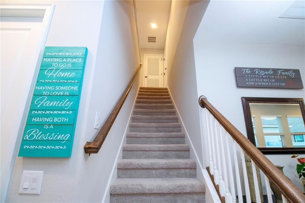 Stairway leading up to the upstairs loft and Bedroom 3 with oversized closet.