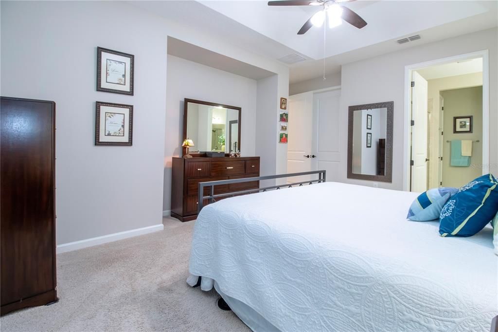 The primary suite offers a serene retreat on the first floor, oversized walk-in closet and its own ensuite bathroom with an oversized walk-in shower and separate dual sinks with private access to the brick paver screened in lanai.