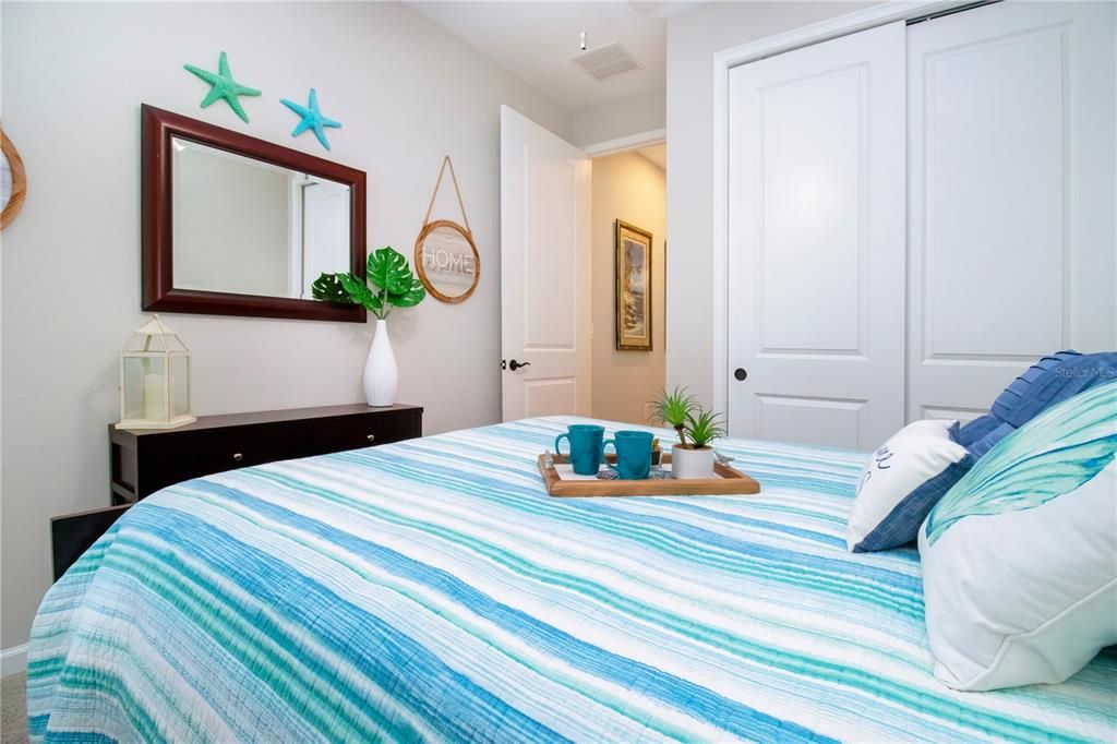 Bedroom two with large closet on the first floor with full bathroom