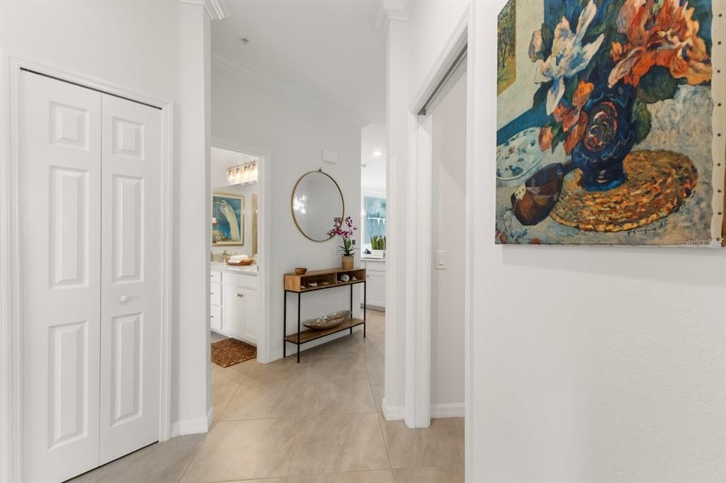 Entryway looking into Guest Bath on left, laundry room on right, and straight through to main living area