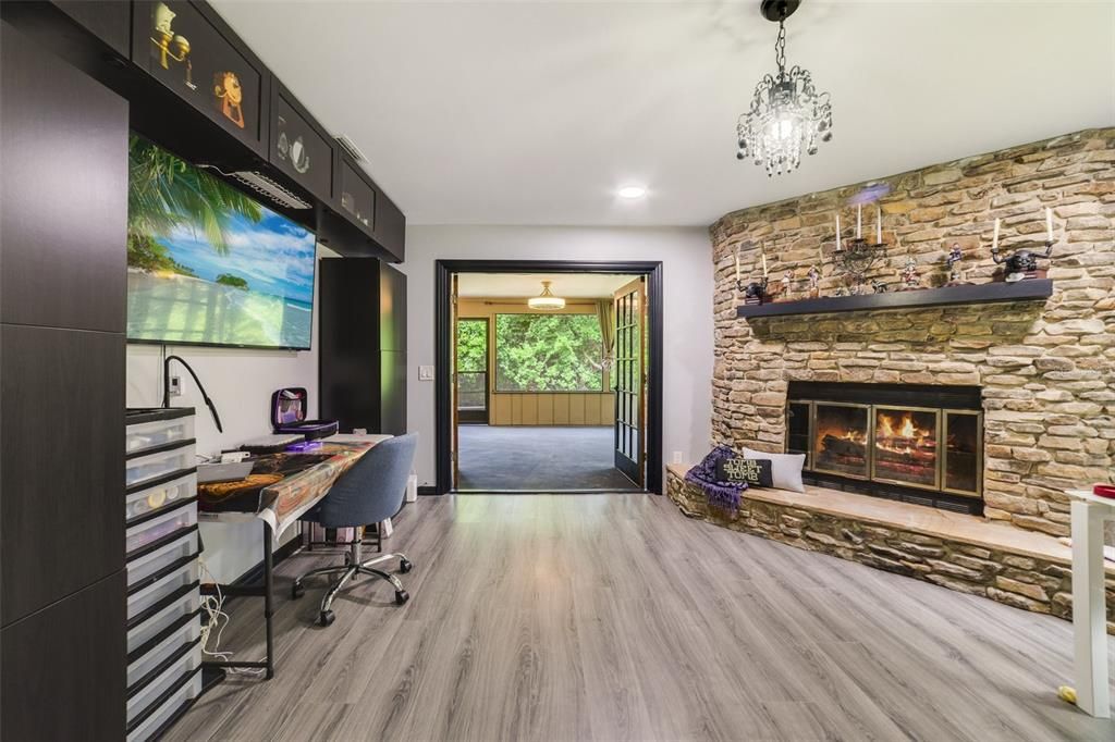 Fireplace with french doors to Florida room