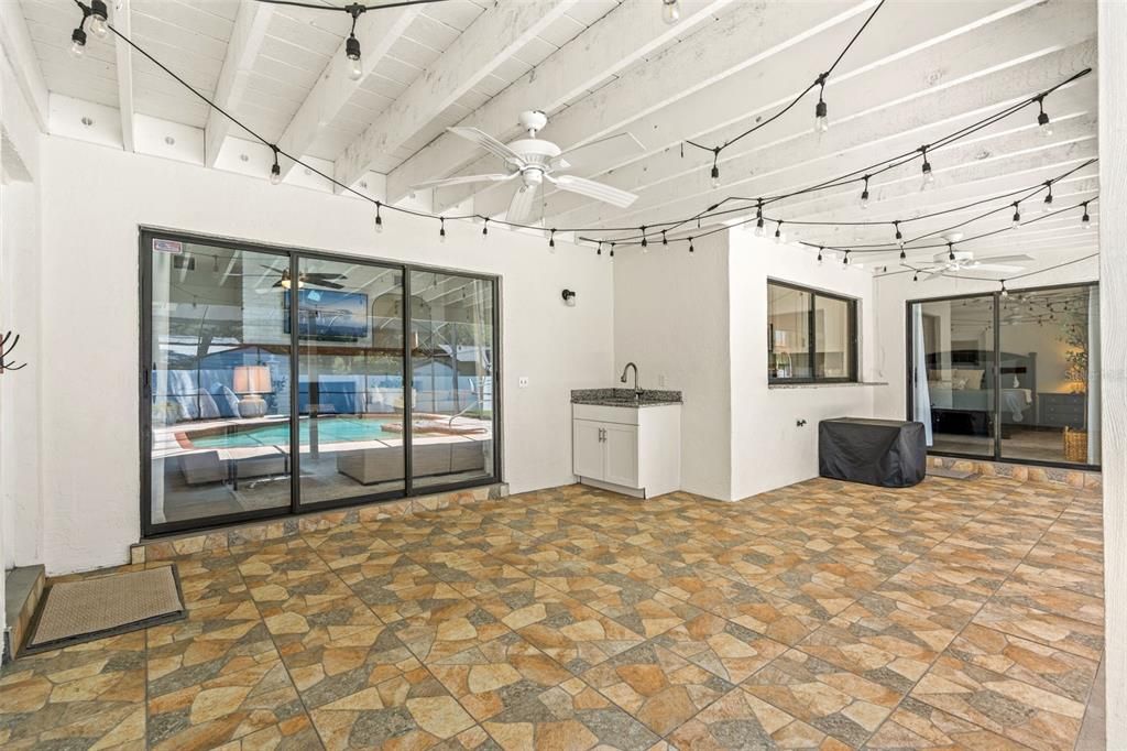 Huge outdoor covered patio with sink