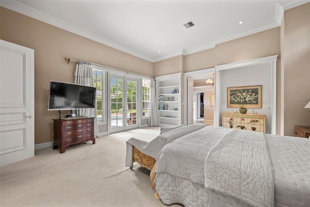 Primary Suite with French doors opening to the pool