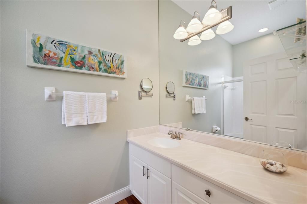 Second guest bathroom next to 1st guest bedroom and 2nd guest bedroom. Large counter creating enough space perfect for toiletries and getting ready .