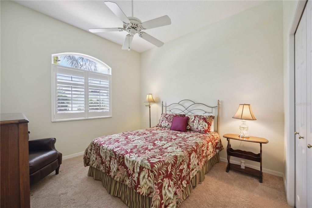 2nd guest bedroom with built in closet in the front left wing of the home next to office.