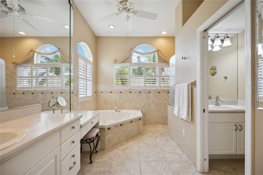 Get ready in this elegant primary bath with a double vanity, dressing table and private water closet for that extra privacy.