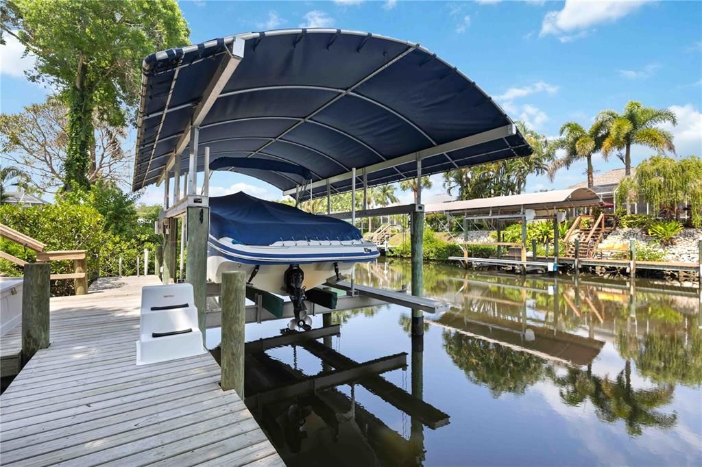 Extended private dock with 15,000 pound, Alumavator covered boat lift