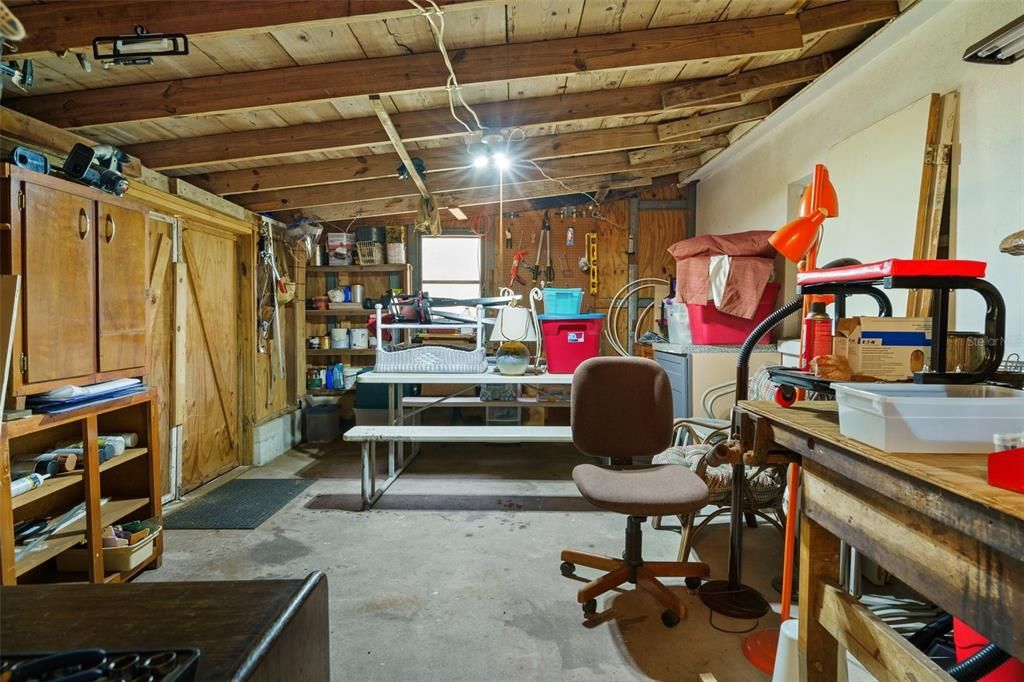 Lots of great storage possibilities here, or turn this space into your workshop. Notice the double doors left of center that open to backyard making it easy to move things in and out.