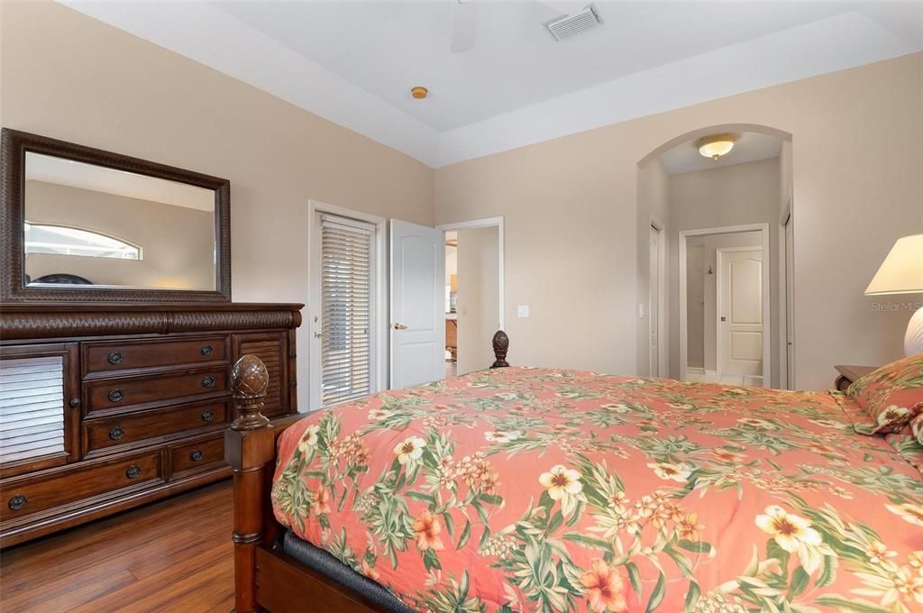 Primary en suite bedroom with door to lanai.