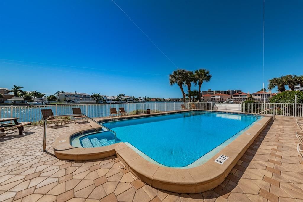 Amenities include a Waterfront Heated Pool, Tennis, Pickle ball, Fishing Pier, Grill and Picnic Area.