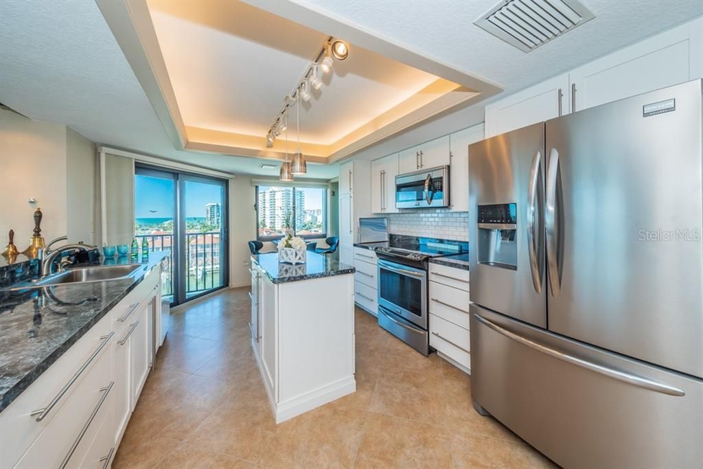 Light & Bright Kitchen features include new stainless steel appliances, wine fridge and new white shaker style cabinets.